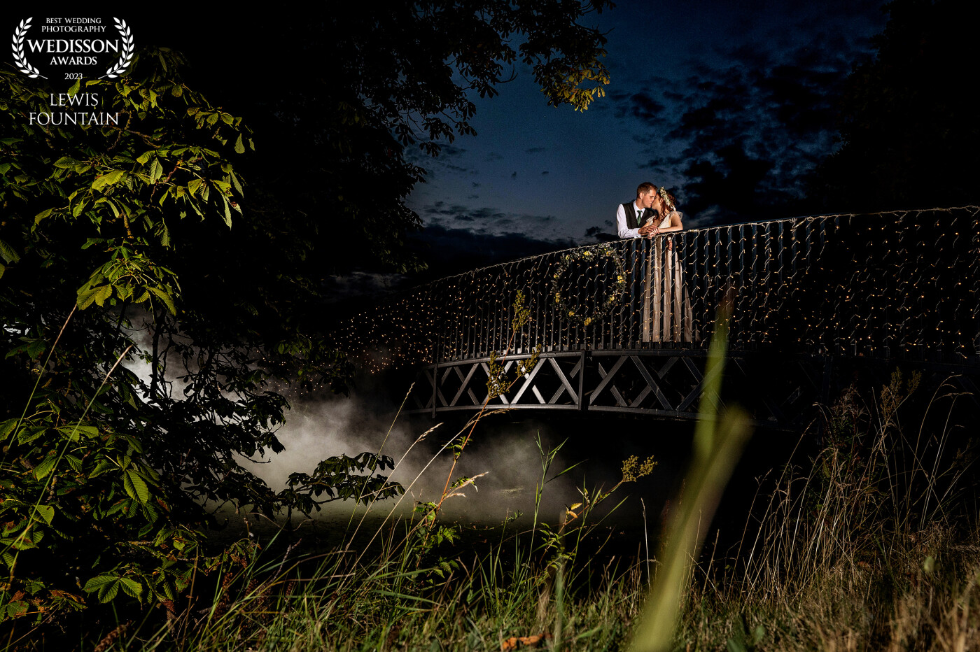 The is one of the main features at Bassmead Manor Barns, and every bride & groom requests a shot on the bridge! <br />
We see the same shot week in week out, the same angle, nothing new.<br />
We had an idea to create something different for Lauren & Dan, and with the use of four carefully placed lights, two smoke grenades and some helpful groomsmen, we created something unique!