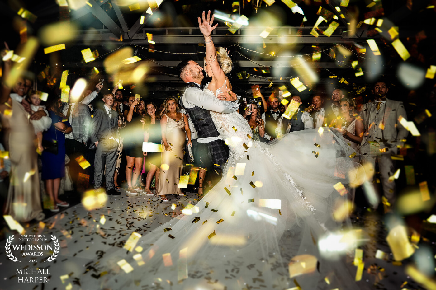 confetti madness! in the final moments of the first dance, the groom picked up the bride and spun around. At the same, a wave of confetti was shot out of cannons which was captured perfectly in this picture!