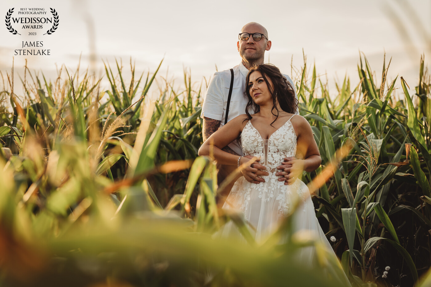 Couple taking a timeout reflecting on the day in a cornfield