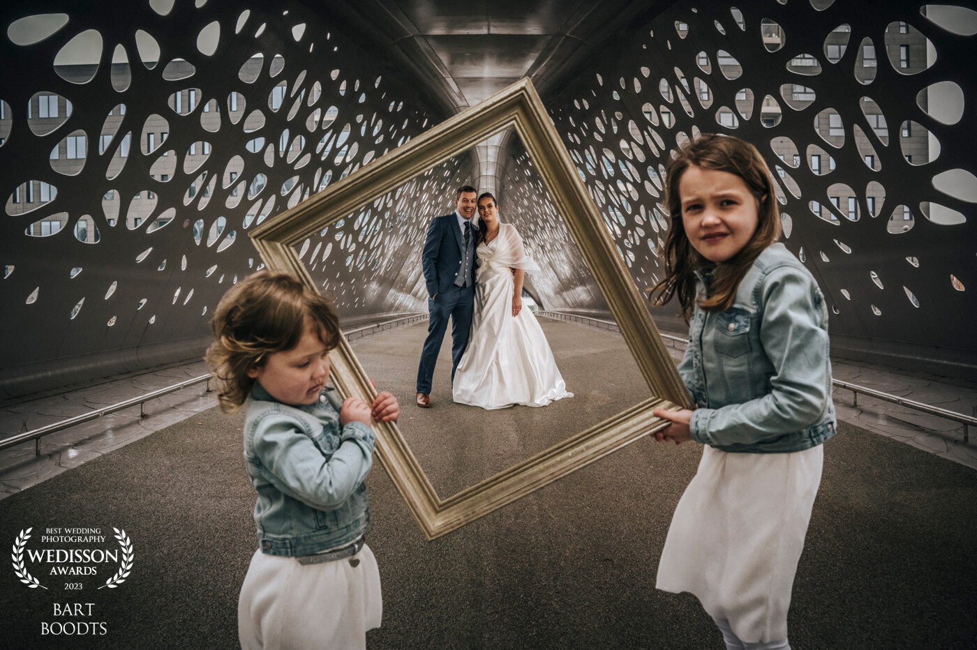 It was a cold day in winter. The bride had the idea for the children to hold this for the image. The children didn't like it at all.
