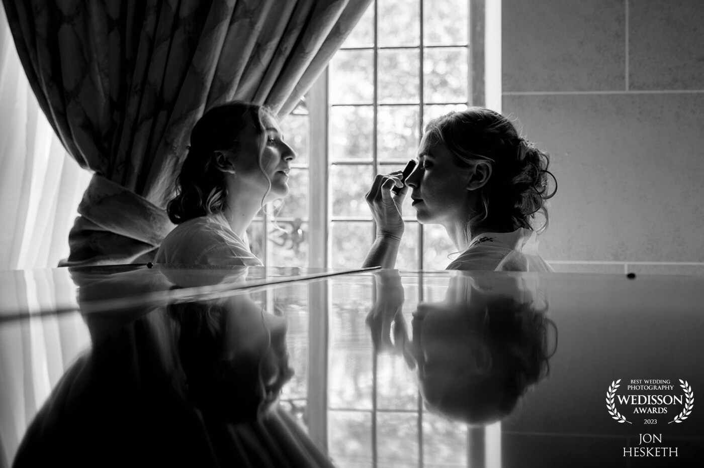 Every room for bridal prep should have a polished grand piano ! The light was amazing, the reflection of Carys and Sian gave allowed me to capture a special moment between two sisters.