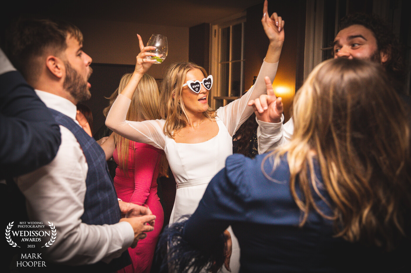 A special moment captured when the dancefloor momentarily opened up to reveal the bride dancing in some personalised sunglasses!