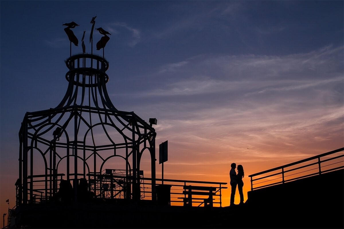 On a calm California evening at sunset, we were excited to photograph the engagement of two incredible individuals.  Zermina & Khattaab chose the 100-year-old landmark, Santa Monica Pier, as one of their favorite places in the Los Angeles area.  We were very excited and honored to photograph both their engagement and wedding celebration.