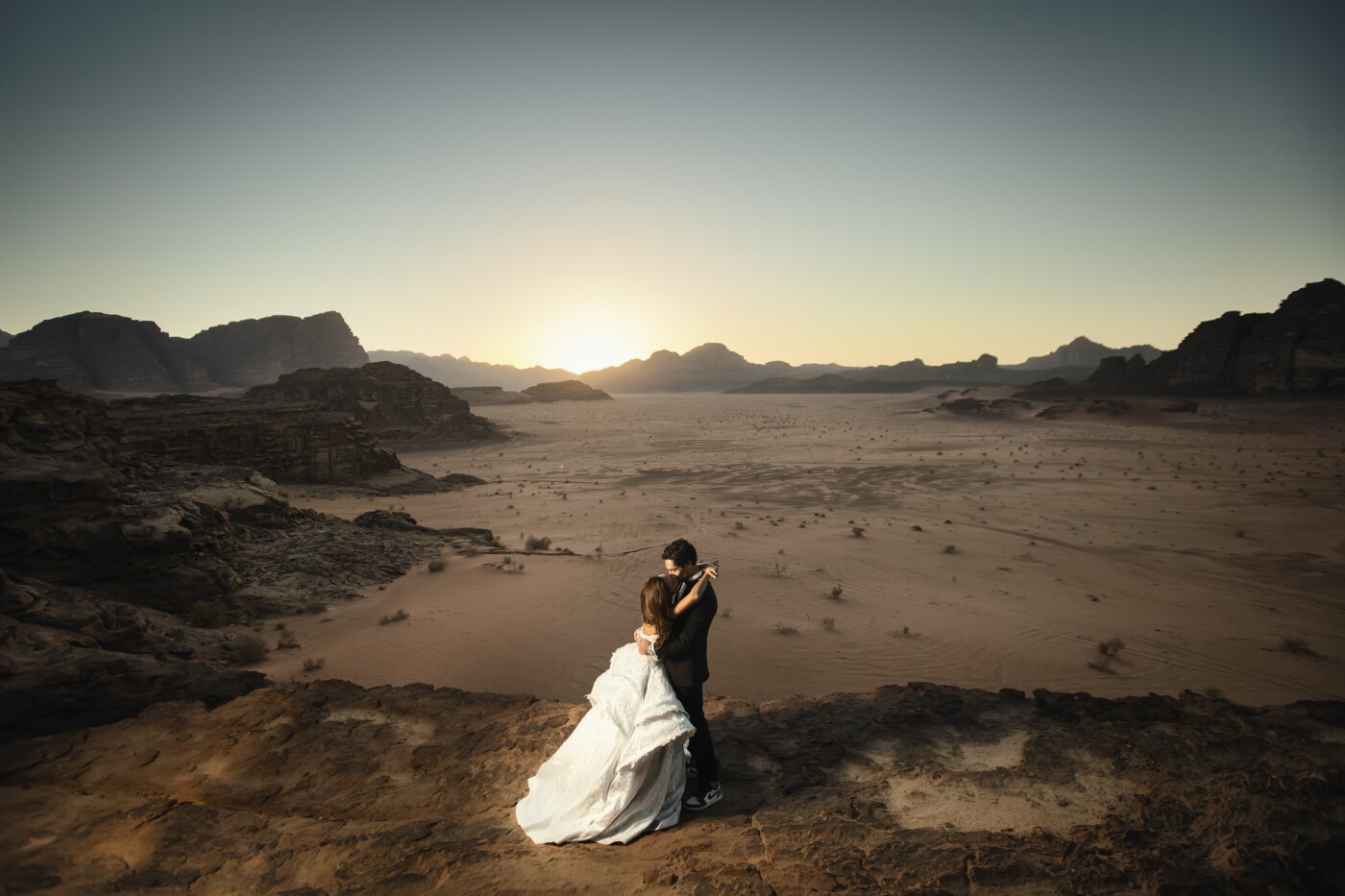 Wadi rum in Jordan is one of the most beautiful natural places on earth. It's not surprising that most sci-fi movies that are set on Mars end up being shot there. It has an other-worldly look and feel to it. I have been trying to convince a couple to come with me on this shoot for a little over a year. Wadi Rum is a 3.5 HR drive away from the capital Amman and deep In the desert. The mountains and rock formations are not exactly an ideal situation for a bride in high heels and a mobility hindering wedding dress.But luckily, Farah and Bilal were as excited about this as I was and equally as crazy. The entire experience was a lot of fun. One glorious thing about the area is the endless blanket of stars and that was something that we had to capture. The bride was such a rockstar because it got extremely cold at night and desert cold is dry and goes through the bone, but she pushed through it until we got what we wanted.