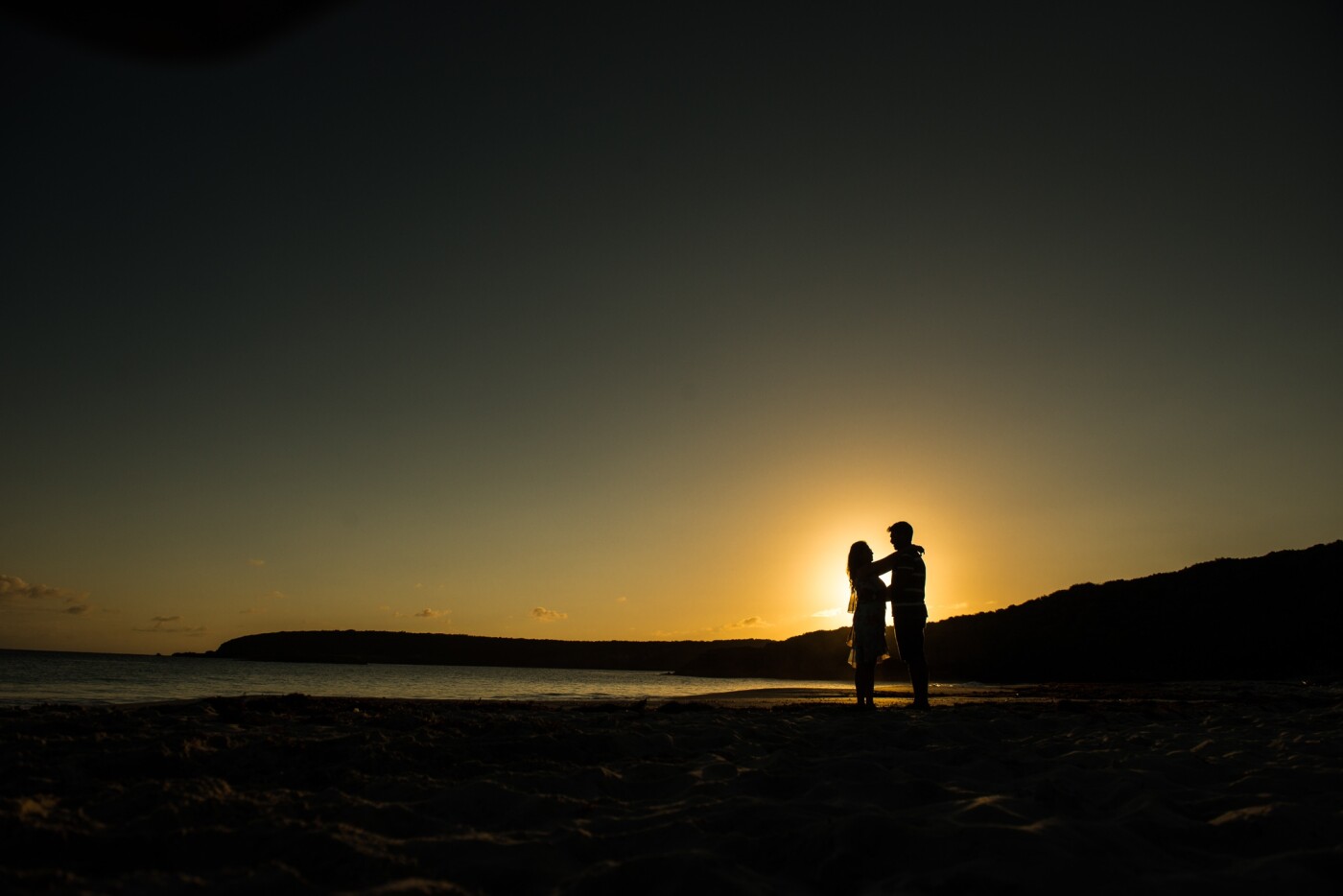 I shot this photo at Vieques, Puerto Rico when I was traveling with my wife. It's a self portrait of us. The beautiful Caracas beach, the amazing white sand and the wonderful sunset behind us was such a beauty that one had to see to believe!<br />
But, grabbing a silhouette was even better.