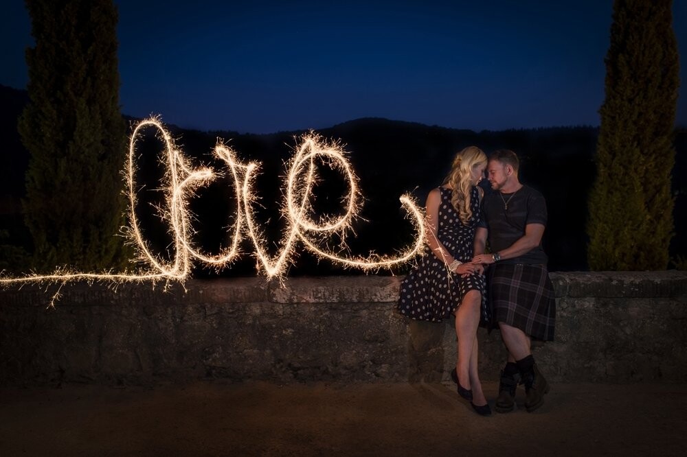 Brendon & Yvonne celebrated their wedding in 3 days in Toscany Italy. This picture was taken on the 3rd day, we did some wine tasting and had a really nice dinner in the Chianti valley. I took this picture at the and of the day, camera and flash on tripod and a long shutterspeed. I wrote the word love with sparkles, becouse Brendon & Yvonne are really really really in love.