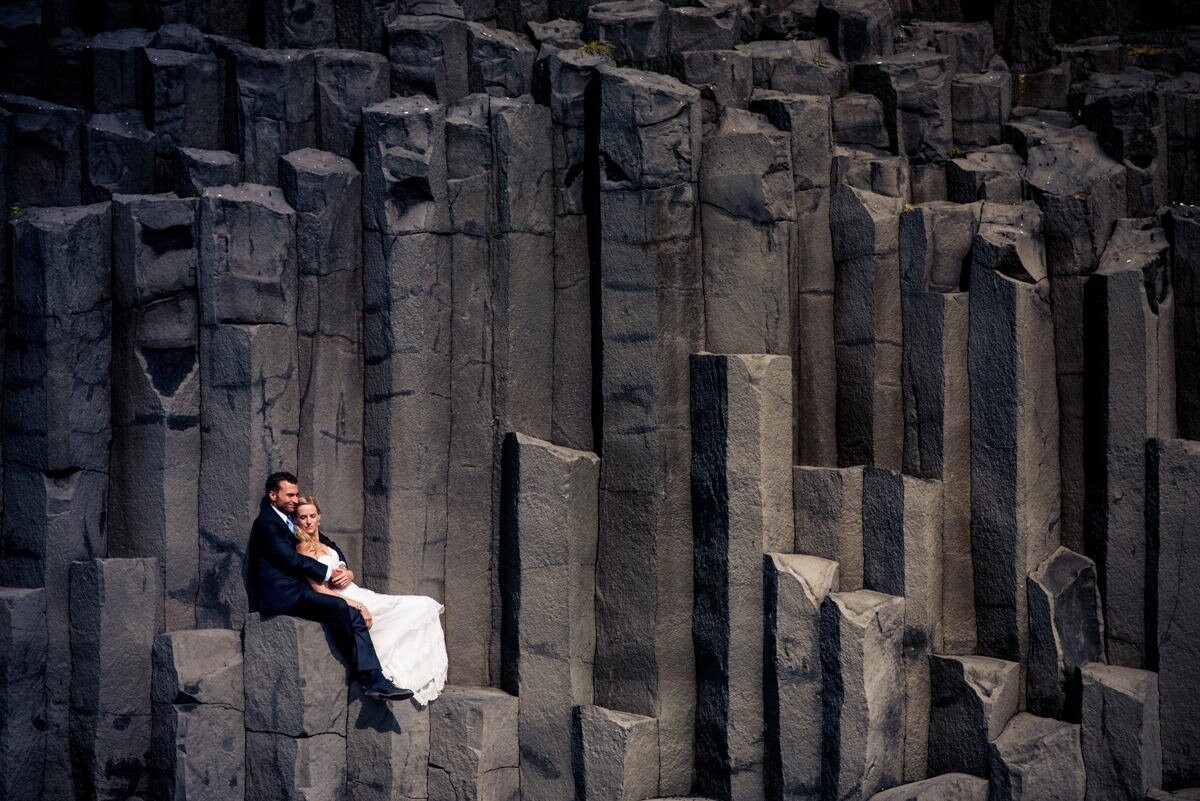 Melissa is an incredible photographer, she think about Iceland to make her wedding unique. We though about the special image for a long time and finally decided to do the session in this little place, very close to Skogafoss, we look for something special about iceland and found these amazing basalt columns. Be there standing up was veeeery difficult so we decided to do it this way... a liitle bit of composition, a bright sun, and two spoons of love. Thats the recipe for this photo. ;)