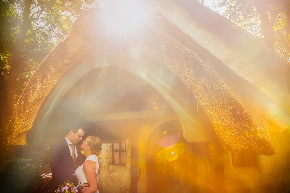This wedding picture was taken during a beautiful late summer wedding in Geldrop a small village in the South of the Netherlands. Linda and Paul said YES in the romantic Castle of Geldrop. This colorful picture was taken during the wedding shoot at the Efteling, a fairytale fun park in Kaatsheuvel. And when the sun shining trough my lens and created the beautiful bokeh, flashes and sun flares in my viewfinder I nailed this shot.