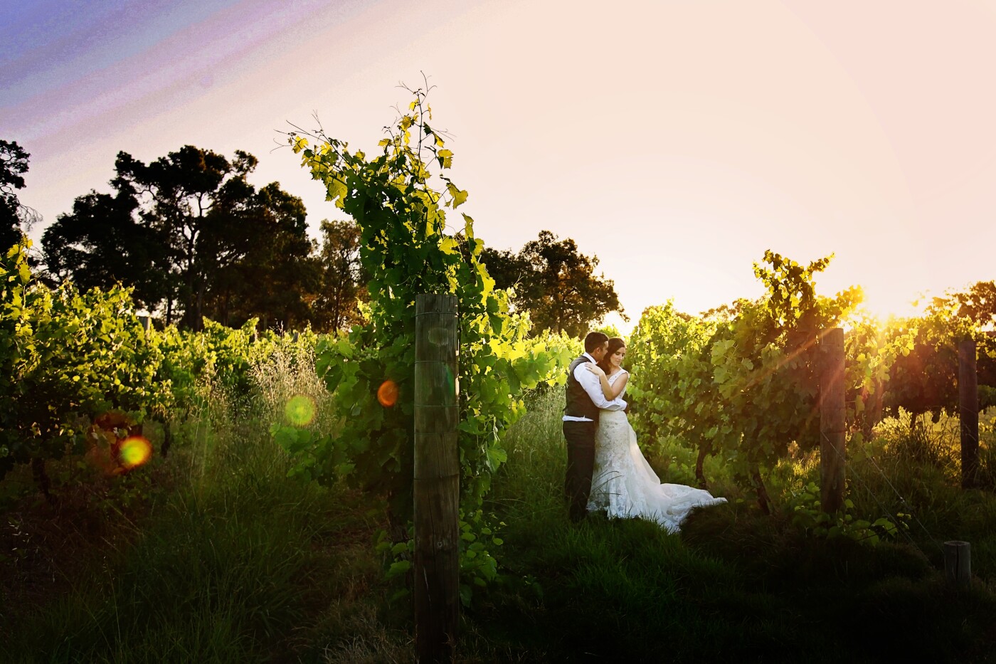 Sandalford Winery in the Swan Valley of Western Australia, provided an absolutely flawless backdrop for the Wedding of Robbie and Jade. With the setting sun, flaring through the vines and high grass, the scene was set for this breathtaking photo of such a stunning couple.