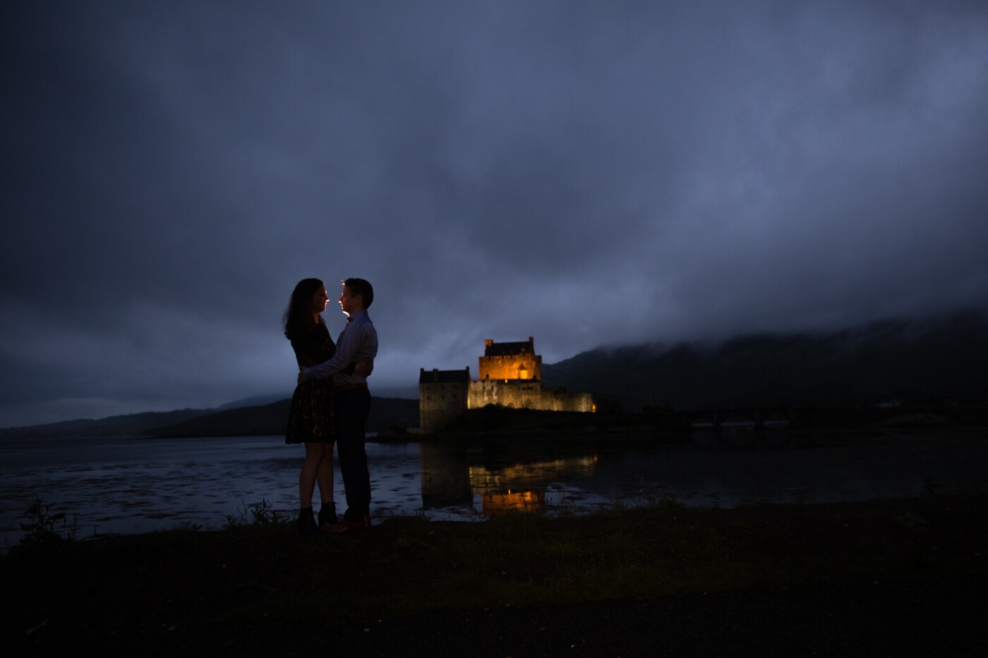 This couple shared my dream to do an incredible Loveshoot at the Eilean Donan Castle in Scotland near Dornie. As specialized Wedding Photographer, we only shoot weddings at old castles and mansions so we totally love this 13th-century castle. This photos was made nearly at midnight in June in the twilight. We parked the car near this great spot, and after some testing in the rain with the couple waiting in the car it went dry and we had about 5 minutes before the rain went back. Back in the car we discovered we forgot the close it, so we had a whole mosquito family the rest of the trip with us. But it was worth every mosquito bite ;).