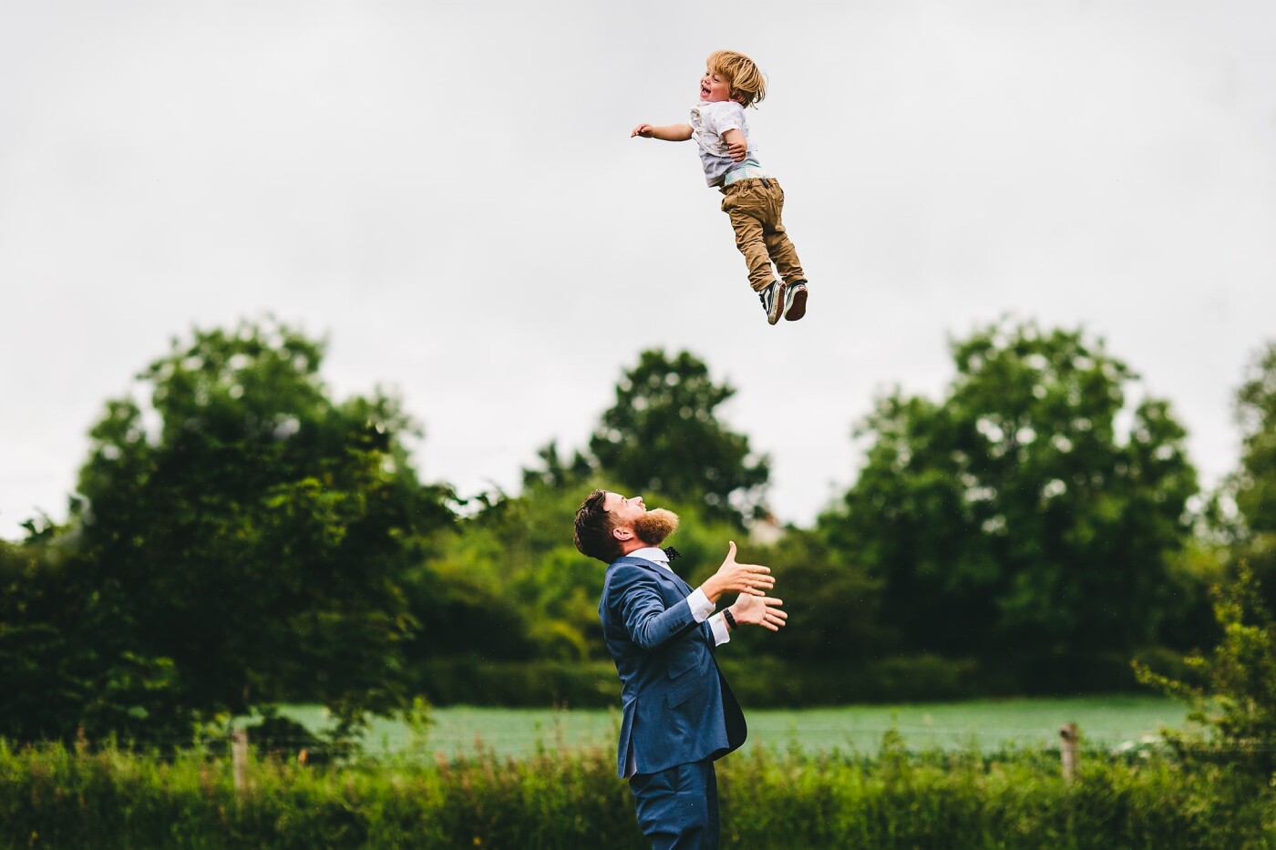 I heard it long before I saw it. The infectious giggle of a little person carried across the field where I was shooting, I turned the corner to find this dude being propelled high into the sky, laughing and chattering as he sailed through the air.