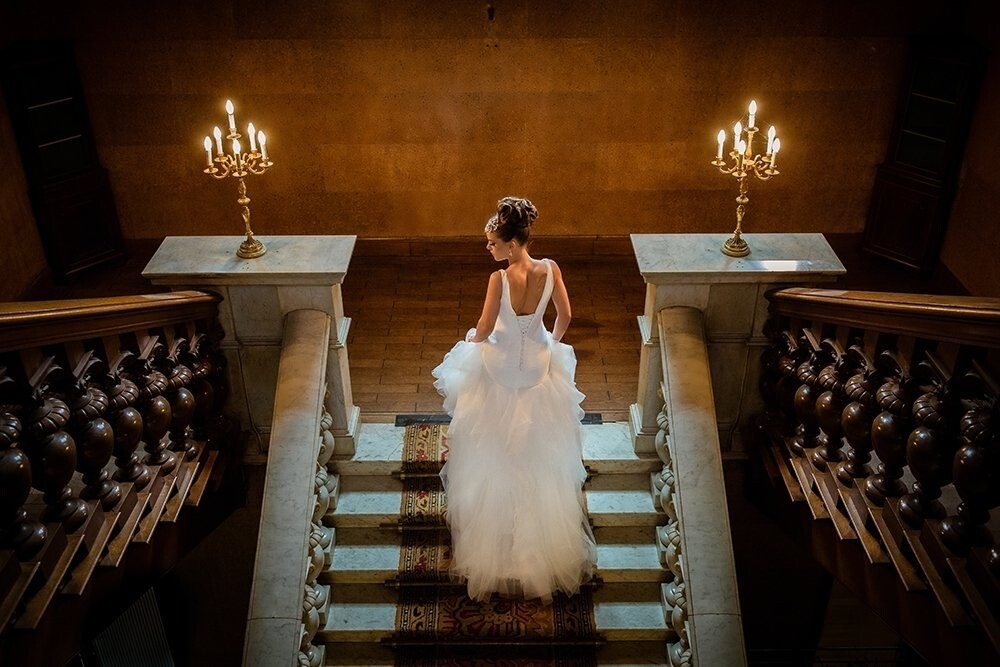 I simply adore bridal photo's like this, so when I got the chance to make this, I was so excited. In the castle of Oud Wassenaar at Wassenaar, Netherlands, a castle that needs repair so much, I got the opportunity to shoot this with light.<br />
The bride is walking up the stairs in candlelight and a heart full of beautiful memories of her wedding day.