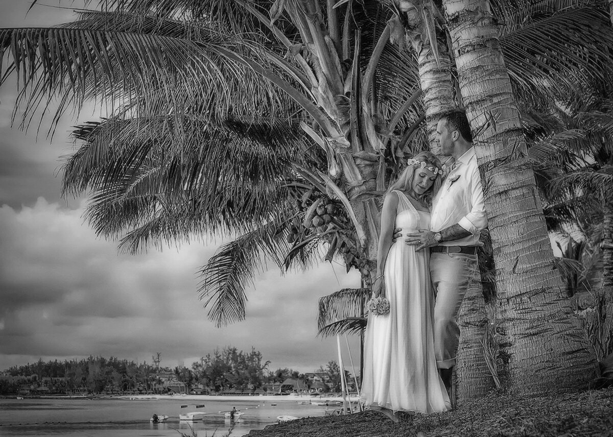 Photo taken after the beach wedding in the north of Mauritius, couple overlooking the magnificent lagoon and full of tenderness 
