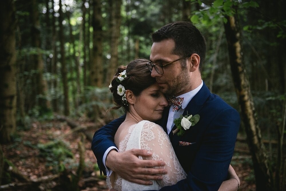 Amélie & Nicolas got married on a gloomy day of June, in an amazing castle, with their closest friends and family. We headed to the woods nearby for their wedding pictures and we stood there, in the shadow of the trees, and listened to the birds chirping. It was an amazing day.