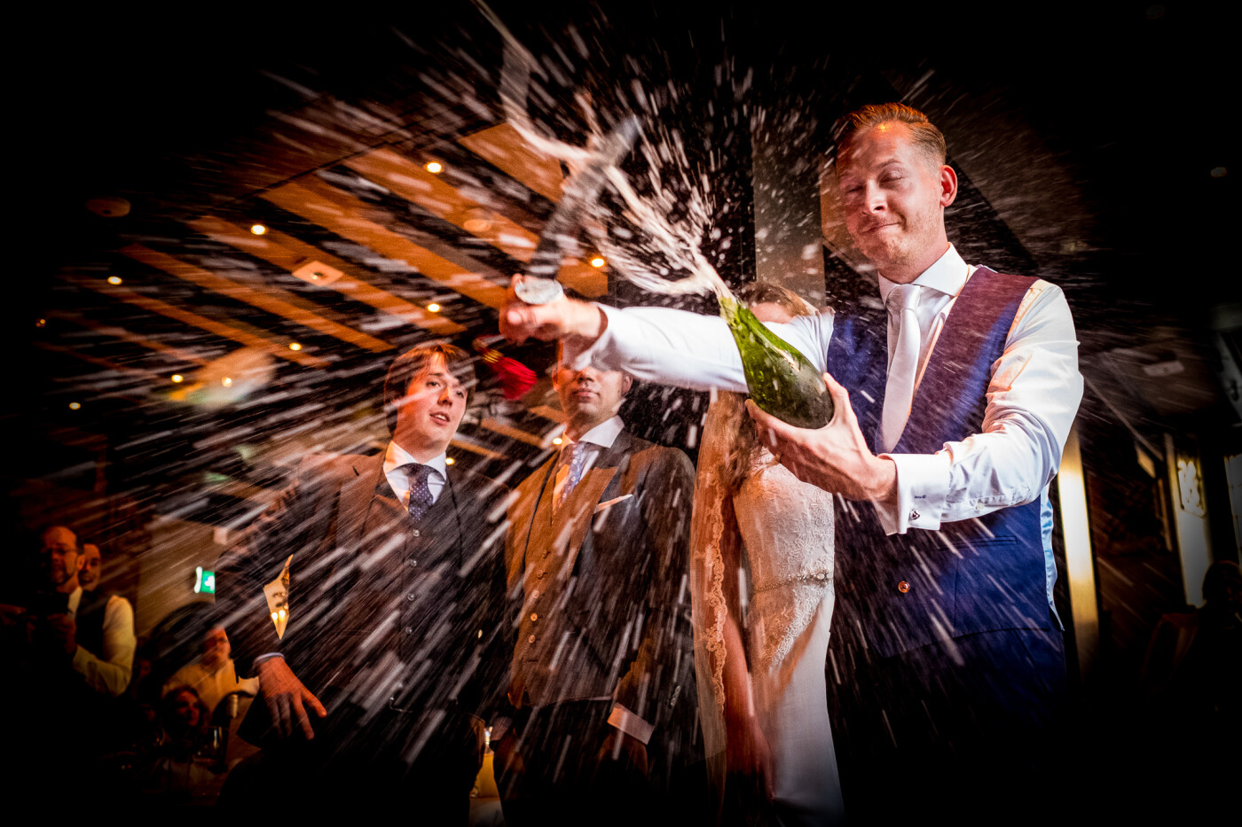 Did I get wet during this sabrage? You bet! But that's the point of going to the extremes for every photograph, right? Matthew practiced this a few times before the wedding, which possibly added to the success of this image. This wedding in The Hague was a very memorable occasion, with beautiful people from all over the world.