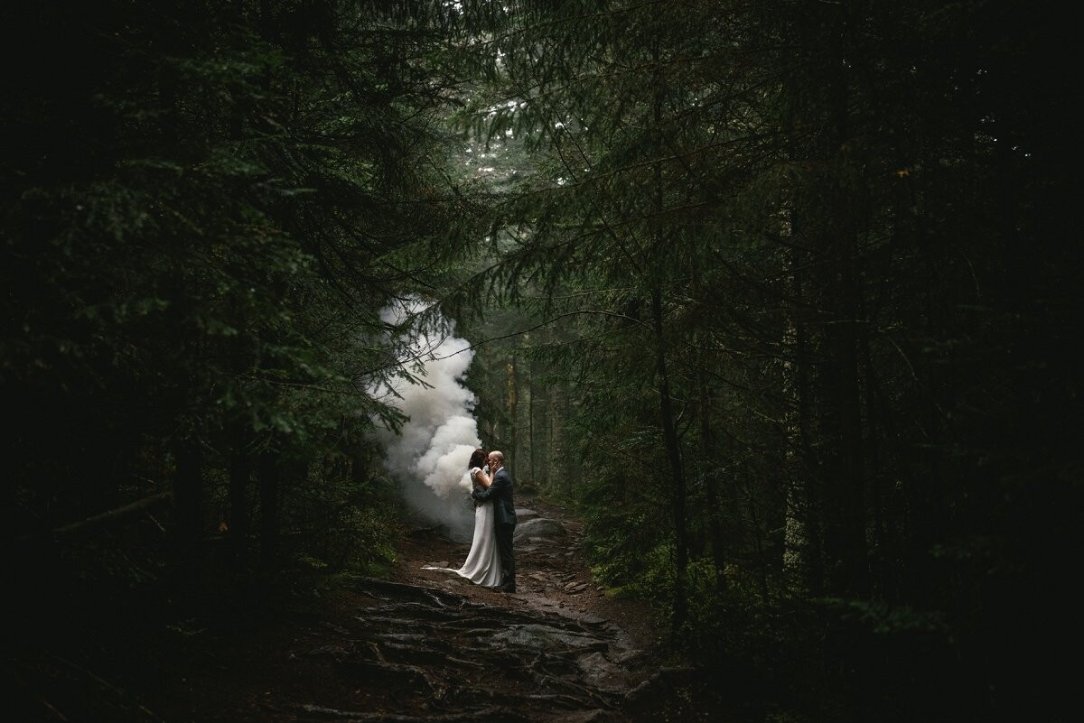 In this forest, we loved how the trees were hugging and the wind was softly talking to us. I had a smoke bomb with me, and as it deployed and they hugged, it created huge wings behing her, creating this special picture that seems coming from another world.