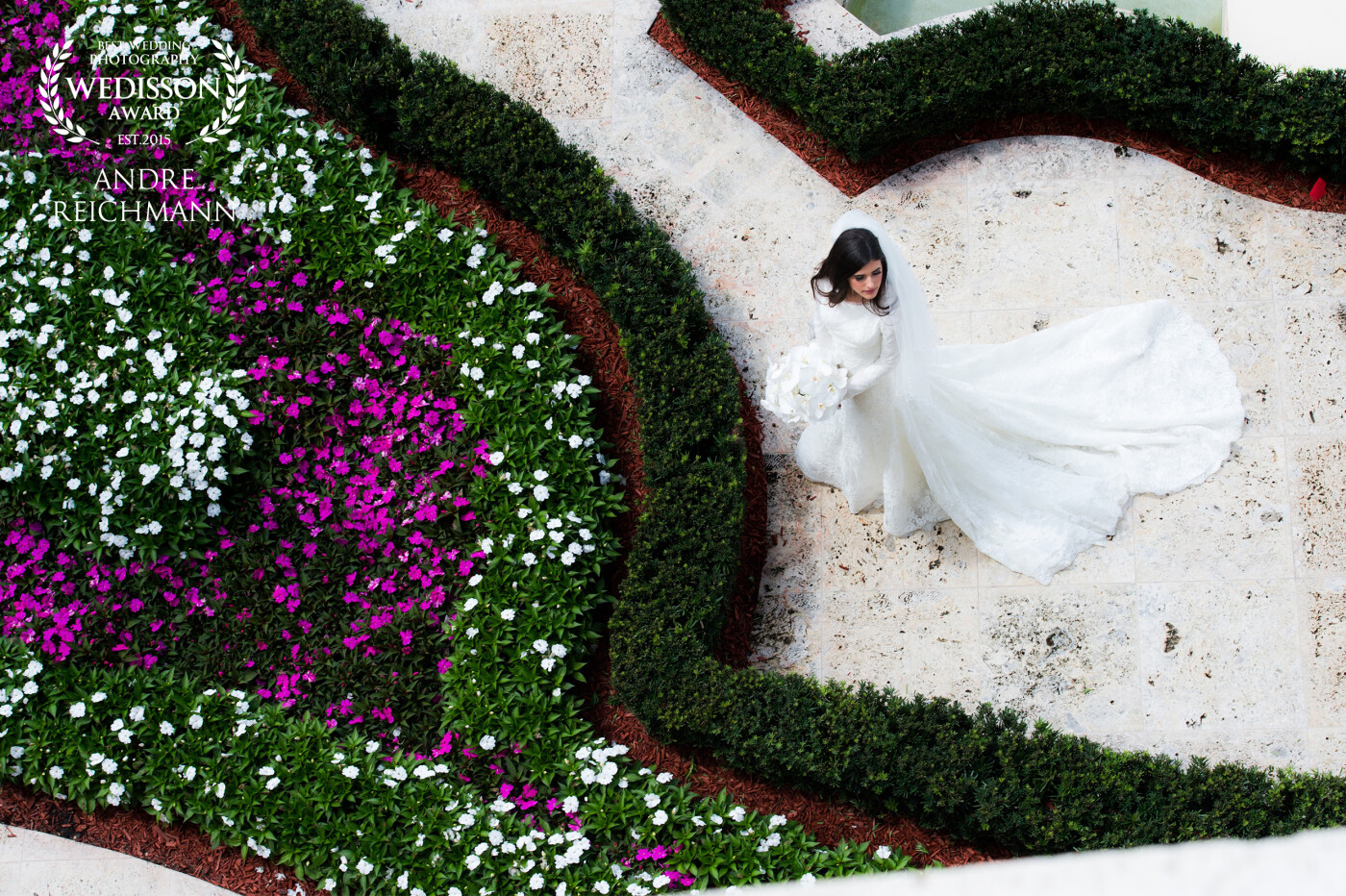 This incredible bride, paired with a beautiful venue, allowed us to capture one of a kind photos. This shot was taken from an overlook above the garden in the golf course, and we just the right look the dress and flowers looked stunning.