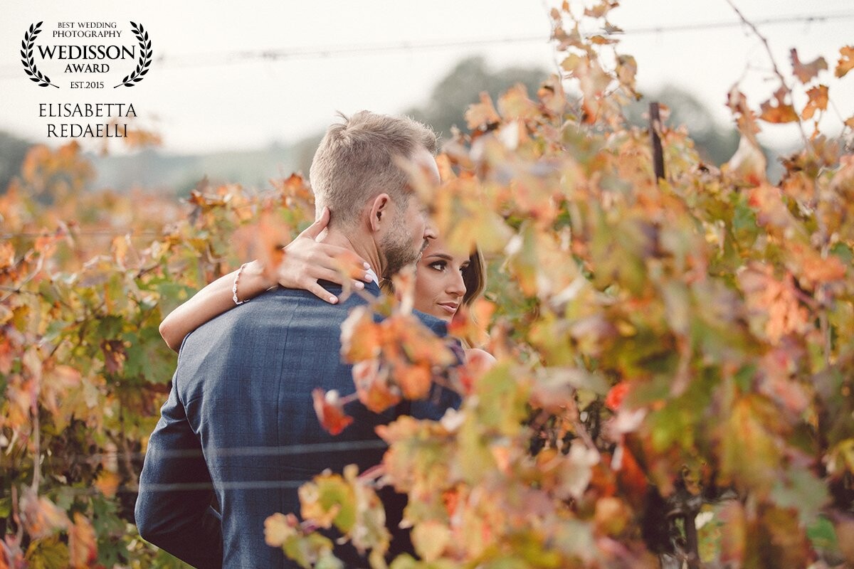 Let them get lost in each other and capture the moment where they forget you're there.  Framed with the Autumn vineyards giving their last bit of color before retreating for the winter. 