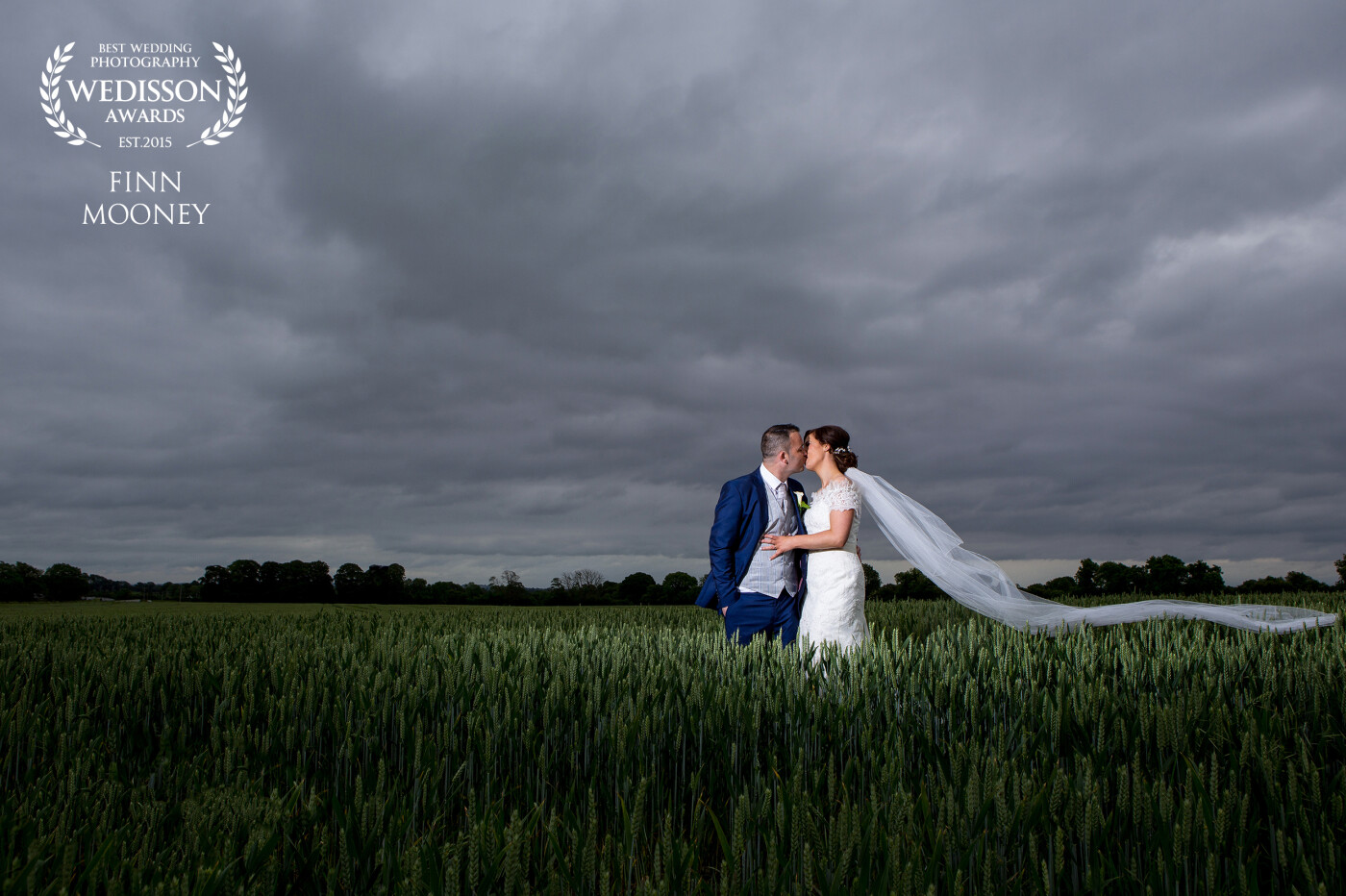 The wedding of Johnathan + Richelle, a really lovely relaxed and fun couple. We were on our way from the church to the reception venue and seen this beautiful field, so decided to stop for a shot, the crops were the perfect height for the veil to sit on and allow a strong composition.