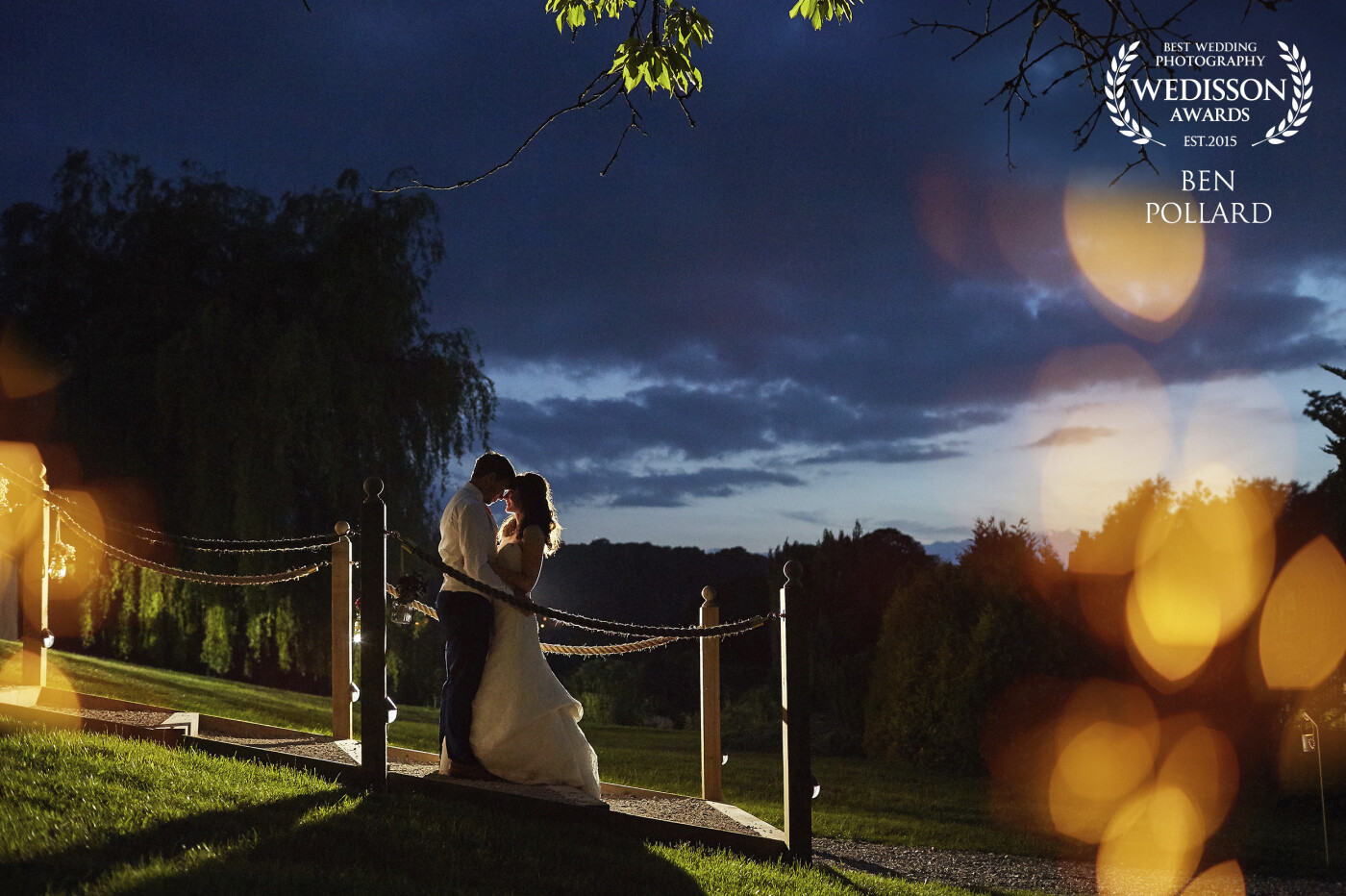 A magical evening in June, with a dab of flash from behind the couple and some foreground added in post to warm it up a little. The end to a perfect day for a very charming pair of newlyweds.