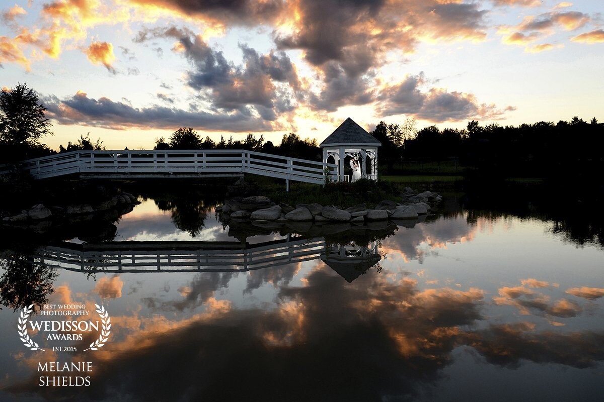 This photo was taken during the wedding reception, Emma made sure I kept an eye on the time for a sunset shot but I could never have planned that the clouds would roll out like this. I was across the pond with a herd of their guests on the left side trying to take photos but it turned out beautifully! 