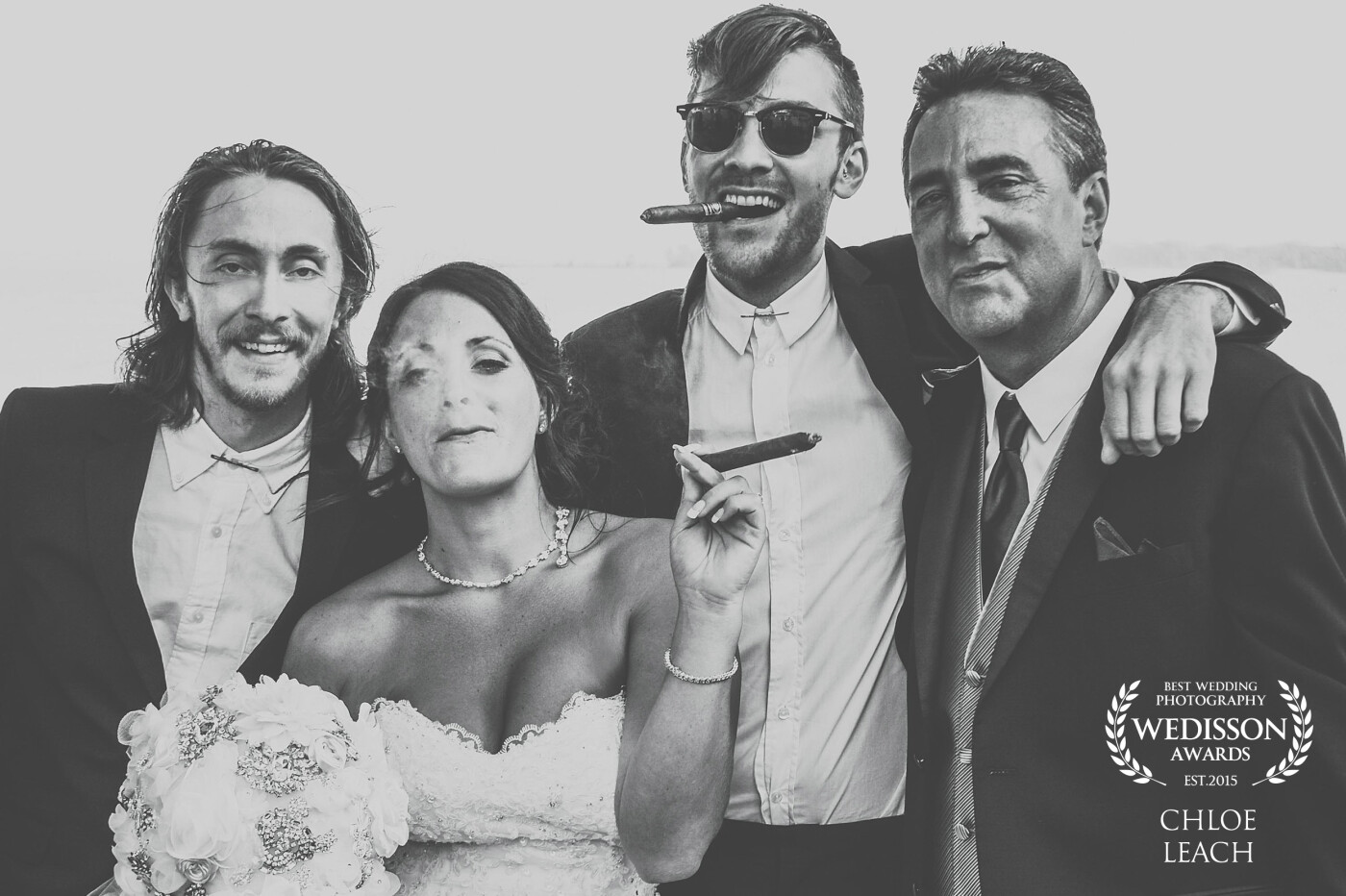 As a photographer and a romantic, I am always looking for organic moments like these: A gorgeous bride on her wedding day steps out back with her father and two brothers to enjoy a celebratory cigar. I just love when class collides with badass!