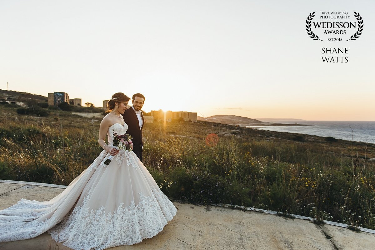 A perfect moment with perfect light. The bride & groom were strolling to our intended location for their portraits when this photo was taken. 