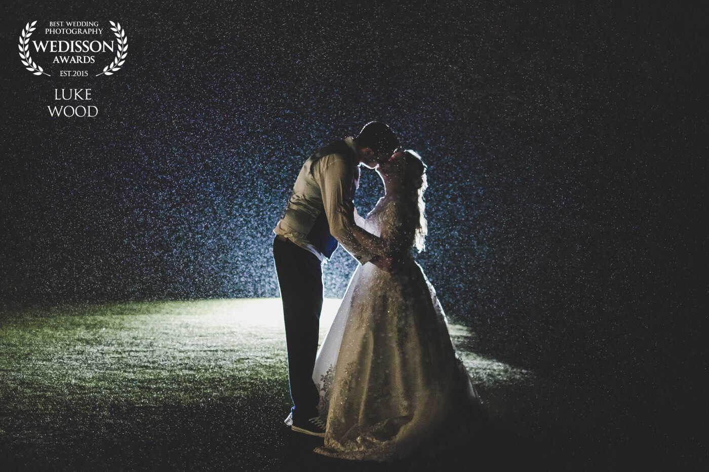It rained non stop for Tara & Marks wedding at Carylon Bay in Cornwall, we managed to get a few photos around the hotel grounds during the day with umbrella's but I wanted to give them something special before leaving for the day, I set out onto the golf clubs green and set up my flash with my triggers, I did a couple test shots using my second shooter in the frame so I could get my settings right then the bride and groom came outside for us to fire off a few photos, we are really happy with how magical it came out with the rain drops being lit up like stars.