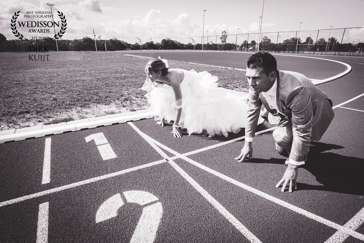 This couple was looking for fun and out of the ordinary locations for their pictures, and so we went to their athletics court. This idea was born quite quick as they were on their marks and set to get married! <br />
Thanks Chris and Linda for having me as your photographer; this was fun.