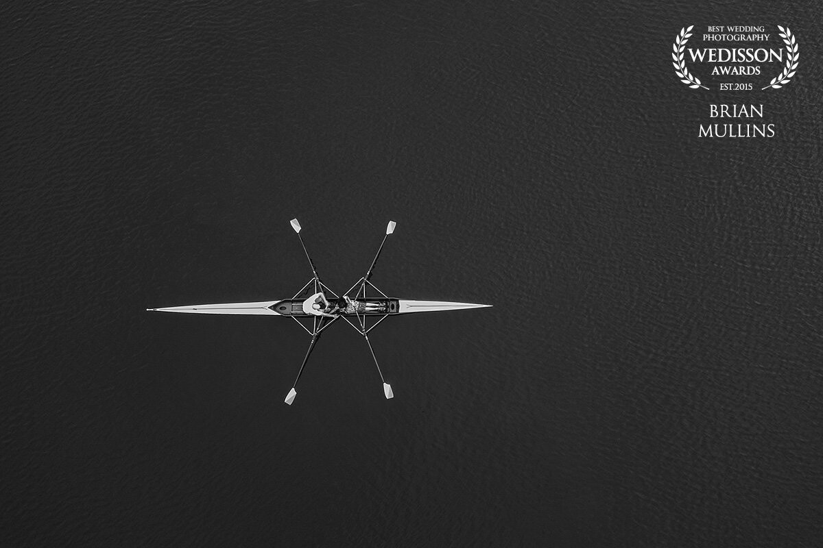 This photo was taken during the engagement session for Alexa & Billy. He was a rower in college so it made sense to go to the lake where he spent so much time. I pulled out my drone to capture a few aerial photos during the session and loved all the negative space in this which lets you focus on the couple holding hand (no easy feat in this type of boat).
