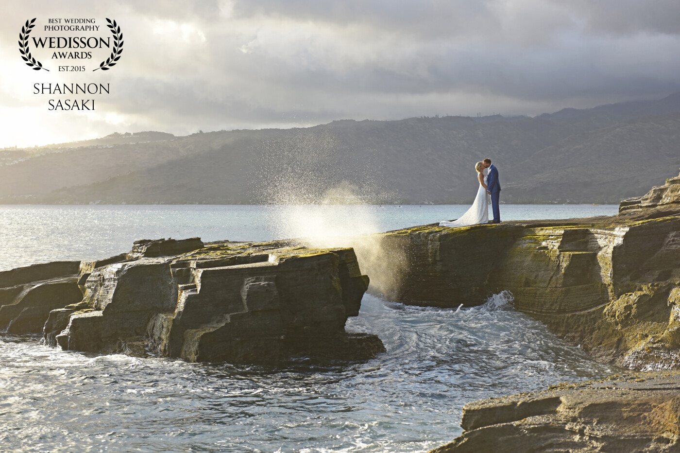 This couple promised their love to one another on a stunning cliffside on Oahu.  Kissing in front of a golden sunset with the waves crashing right next to her, it was this bride's dream come true.  