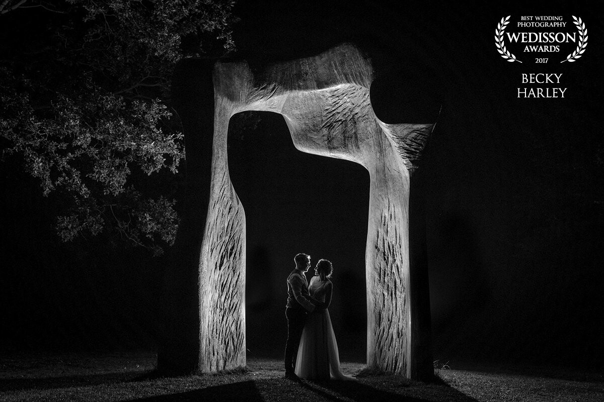 Katie and Richard were married in July 2017 at the Henry Moore Foundation in Hertfordshire, UK. The amazing Henry Moore sculptures that stand in the grounds of the venue provided with some amazing opportunities for photographs throughout the day, and in the evening we made our way to this particular sculpture to make this photo - I loved the arch that framed the couple, and backlit the shot for added drama.