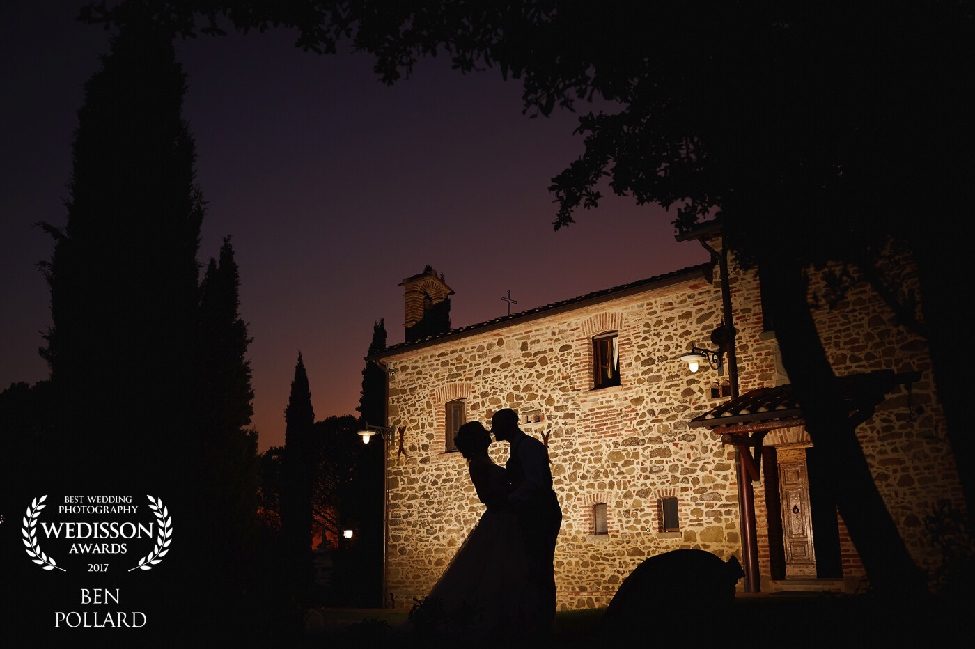 At the end of an amazing wedding in Italy with some incredible sunsets and scenery.I noticed the colour in the sky, put a flash on the building and asked the couple to share a kiss. A simple picture!