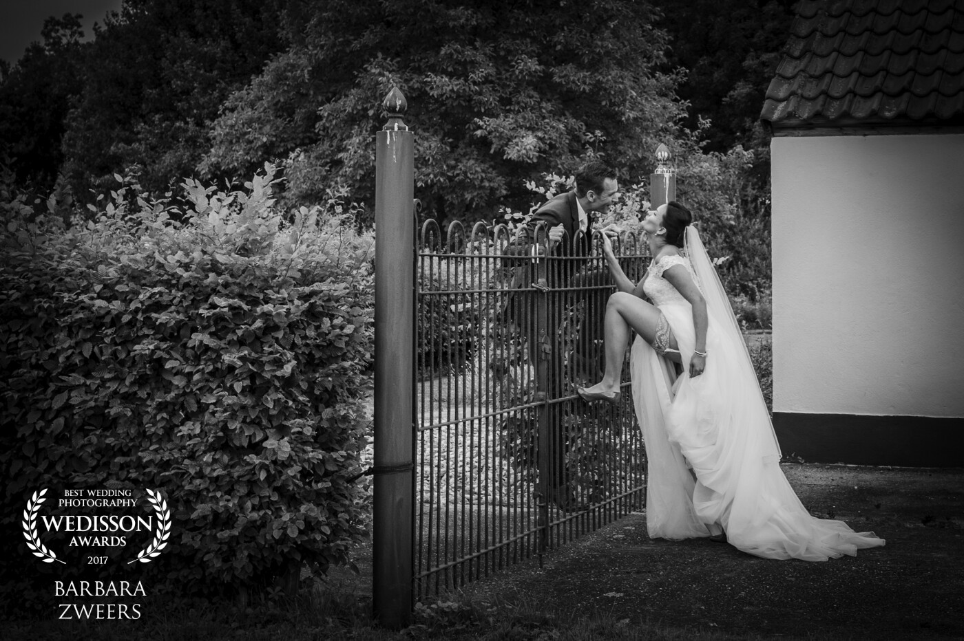 Nico and Mariella got married in the beautiful Netherlands. Instead of having a traditional pose I asked him to catch her from bihind the fence. She lifted her leg and so I got this beautiful scene. Love them! 