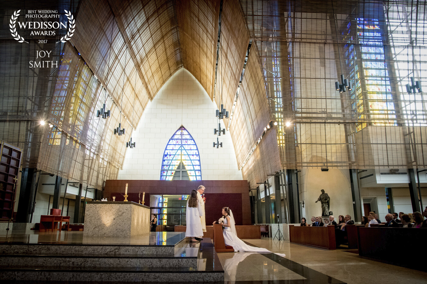 The glorious beauty of The Epiphany Church in Miami, Florida was the perfect accompaniment to this exquisite bride.    The shot is a gorgeous reflection of the inspiring love shared by Steve and Maria, and captures the splendor of this special wedding day.