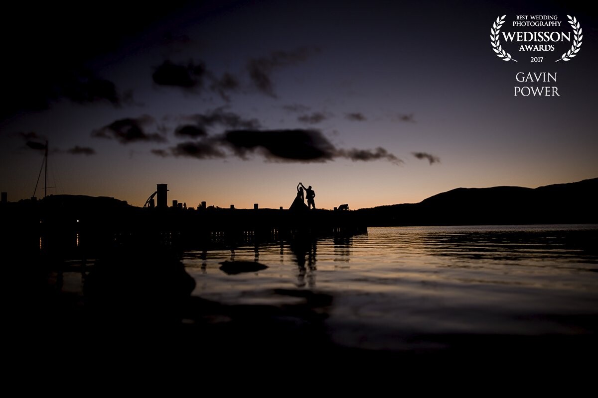 This one was simply one of those moments where all the elements just came together - The Lake District in Cumbria is famed for its beauty, yet also its rain. This day in November was perfect and as a result it caused this beautiful sunset. I knew to create an interesting silhouette I needed shape and movement so I asked the willing couple to just dance. I photographed this shot, low to the lake, from the opposite position to where the sun had just dropped behind the mountains.