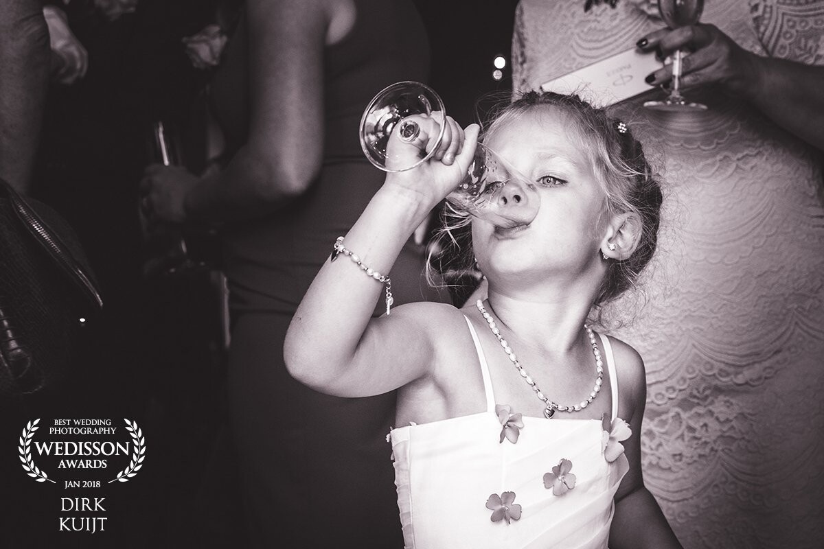 While everyone was congratulating the happy couple after the ceremony, this girl didn’t hesitate and grabbed her drink faster than anyone.
