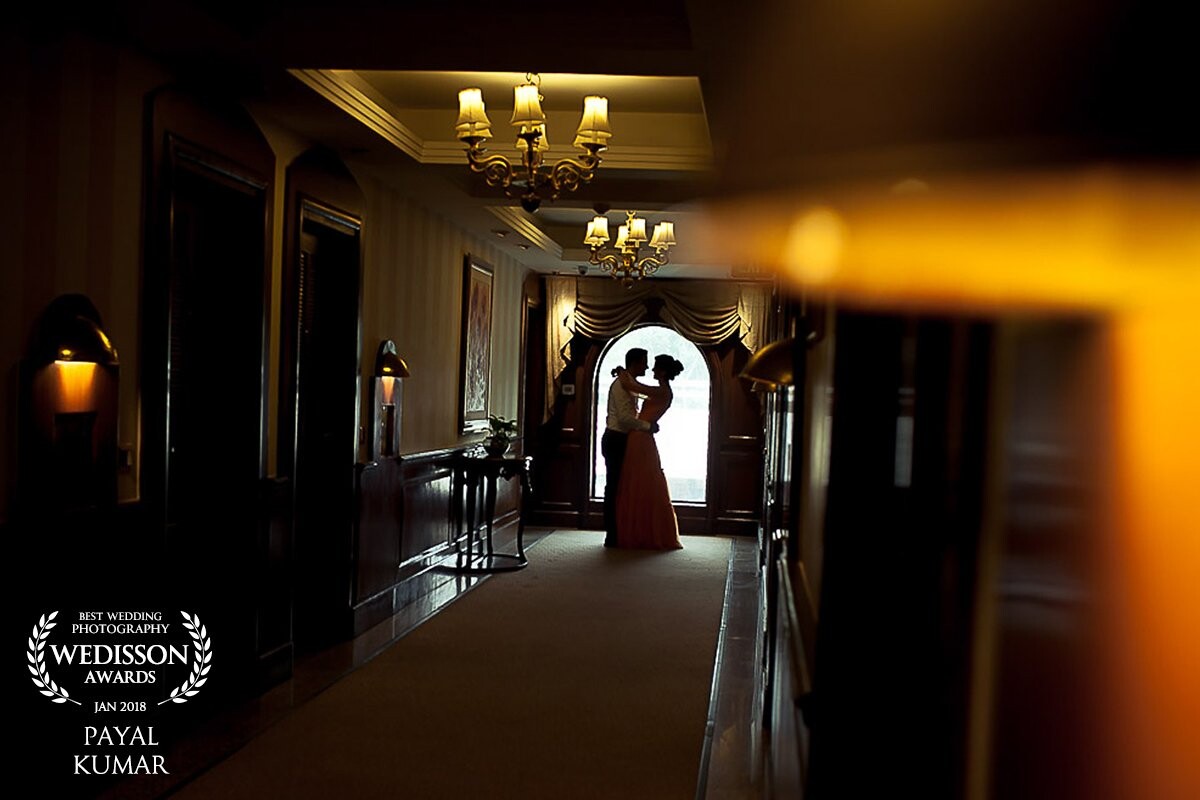 The couple had a post-wedding reception planned in another city and  I checked in the location where they were staying and had me put up. As I entered this corridor I was in love with the 'old world charm' it exuded. This frame felt like it was waiting for me to capture it. I quickly scanned the couple's wardrobe to customise their outfits and planned her hairdo to compliment the old world charm  and romance the spot was calling for and there we were capturing a spontaneous memory for life. It's my personal favourite shot of the season and I'm thrilled Wedison panel acknowledged the effort. 