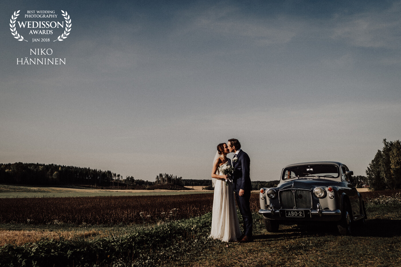 On our way from ceremony to reception we found this beautiful scenery with traditional finnish landscape and beautiful light. We just had to stop for few frames and we had to park this beautiful old Rover to be included in the picture.