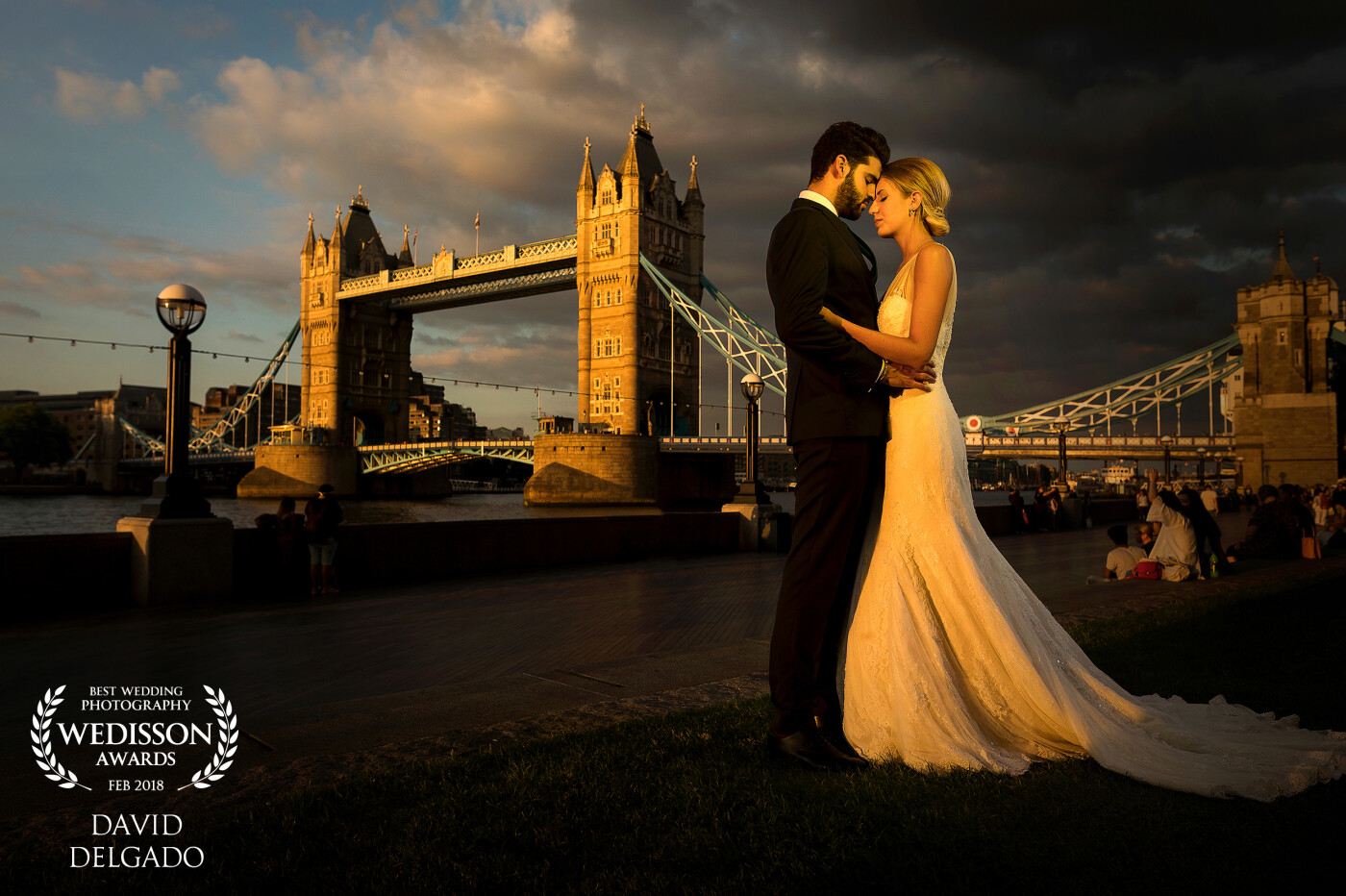 Under the Sun - Mr. & Mrs. Sanchez demonstrating his love in this beautiful emblem of the city of London, sunset, and the famous English clouds that always chase you... What more could you want?