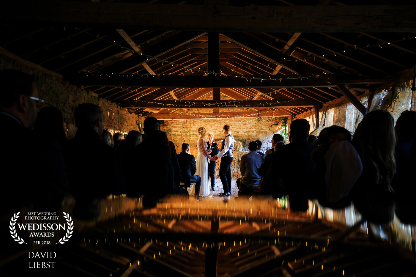 This rustic barn wedding took place on the 23rd of December at Lyde Court in Herefordshire, UK. Loved the day and the challenges that a dark and atmospheric venue provide! The wedding had a Christmas theme so used a mirror to bounce some warmth back into the foreground. 