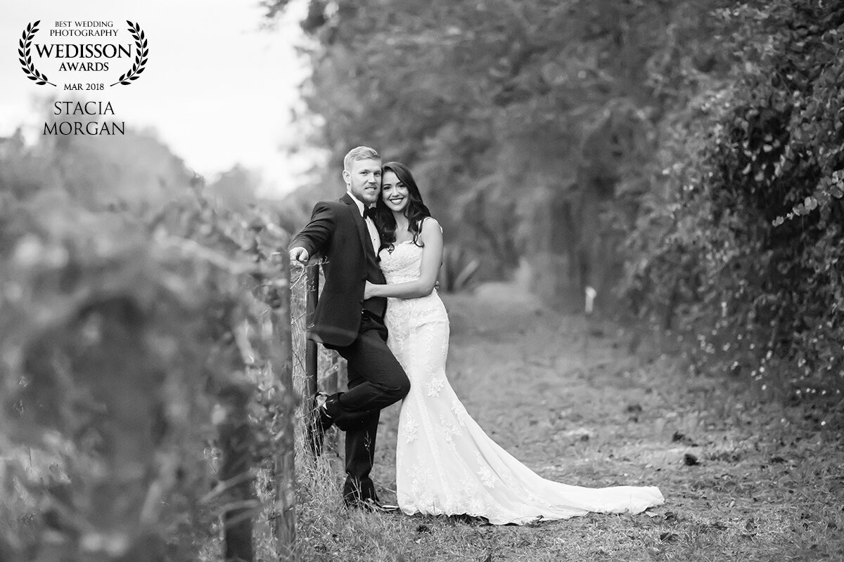 Kyle & Arselia are are old souls with a romantic southern love story. I wanted to capture this in their portraits, so I chose to photograph them along this old fence line and edit this photo in black and white for a timeless feel. 