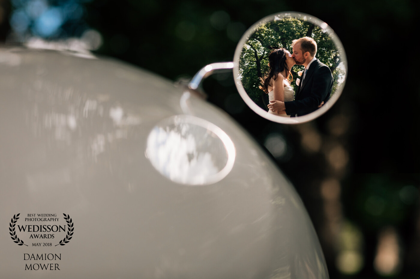 Thank you for this award.  Karena and Adam's wedding at Goodwood House was a fabulous day.  We managed to sneak away from guests in their wedding car and capture this reflection in the car wing mirror.<br />
