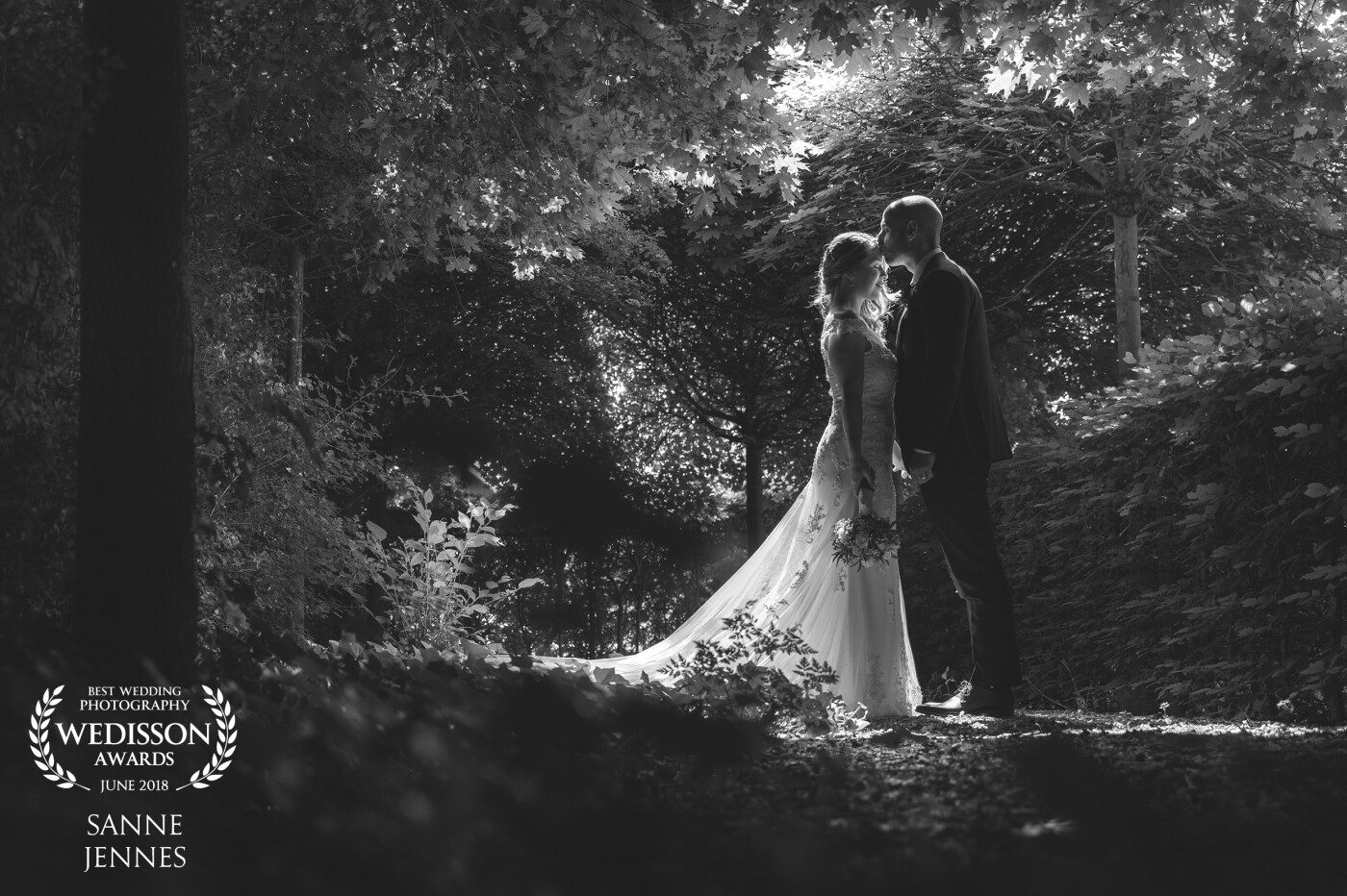 We found this beautiful romantic spot on the grounds of their wedding location, only a little bit of light was able to come through were there were no leaves...