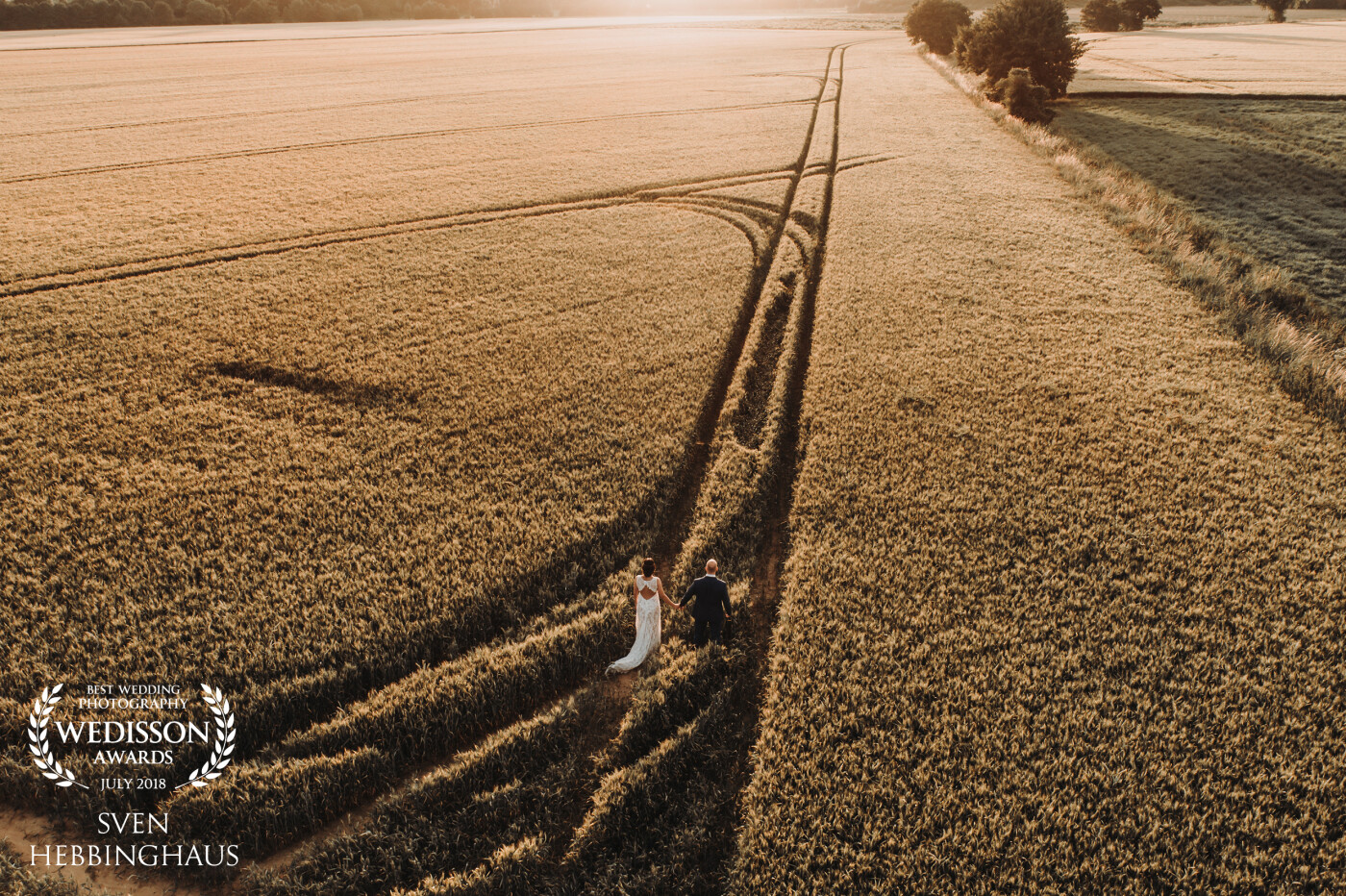 In the evening of a great wedding day, Ayse and Matthias want to join a couple shooting in a field near their wedding location. I took this shot with my drone and the light was amazing!