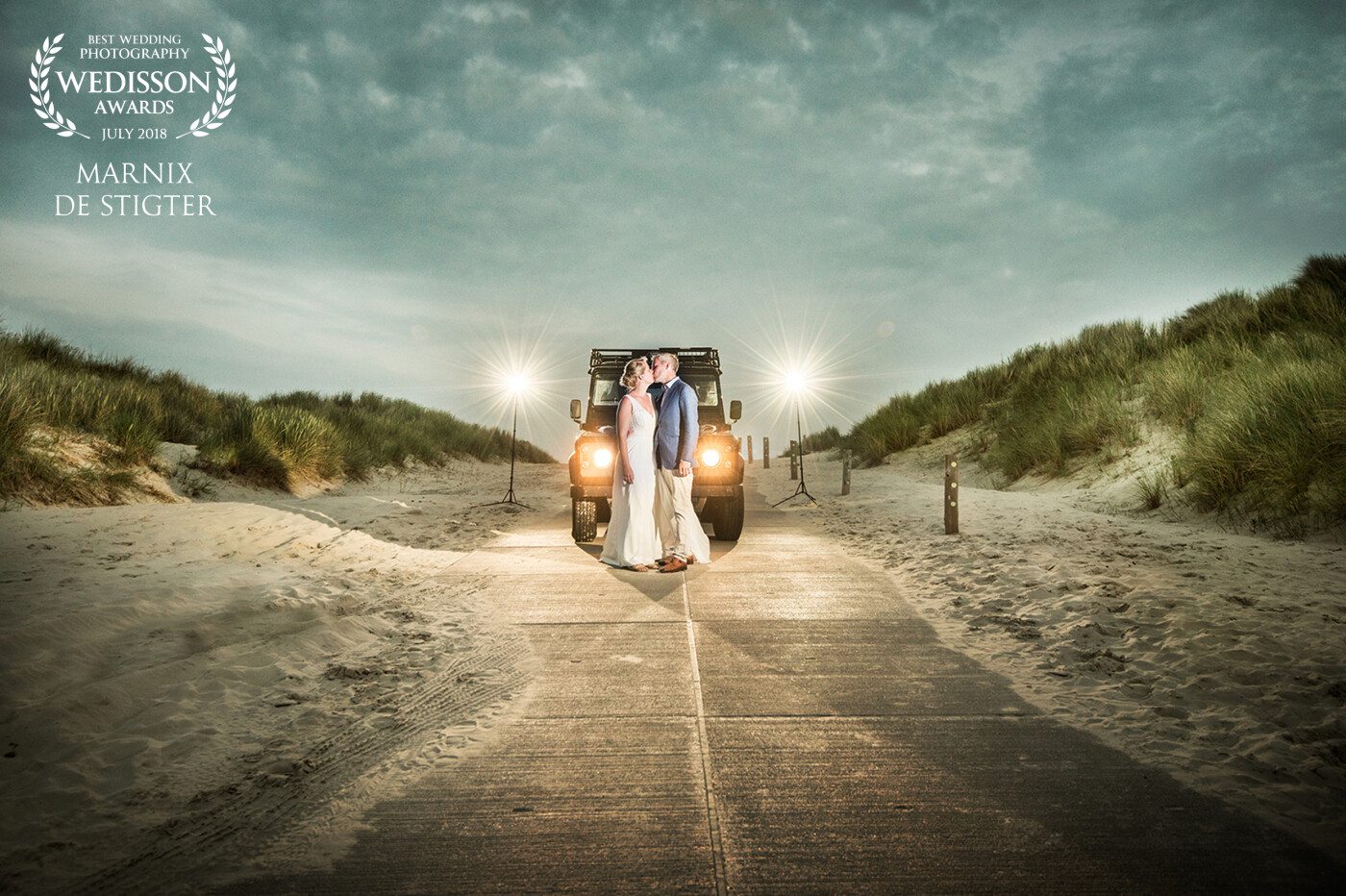 We were hoping for a beautiful sunset at the beach, but unfortunately it was totally overcast that day. Since they had a really bad-ass Defender (in which the bride herself drove bare-feet in her wedding dress) I thought taking this shot fit the moment really well.