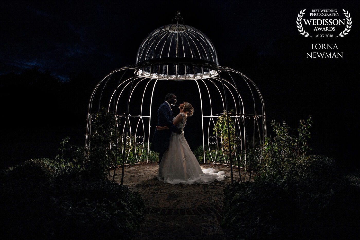 This was the last shot taken of the day when lovely Georgina & Junior got hitched last month at the beautiful Parklands Quendon Hall. We lit up the gardens for a romantic moment to make this picture.