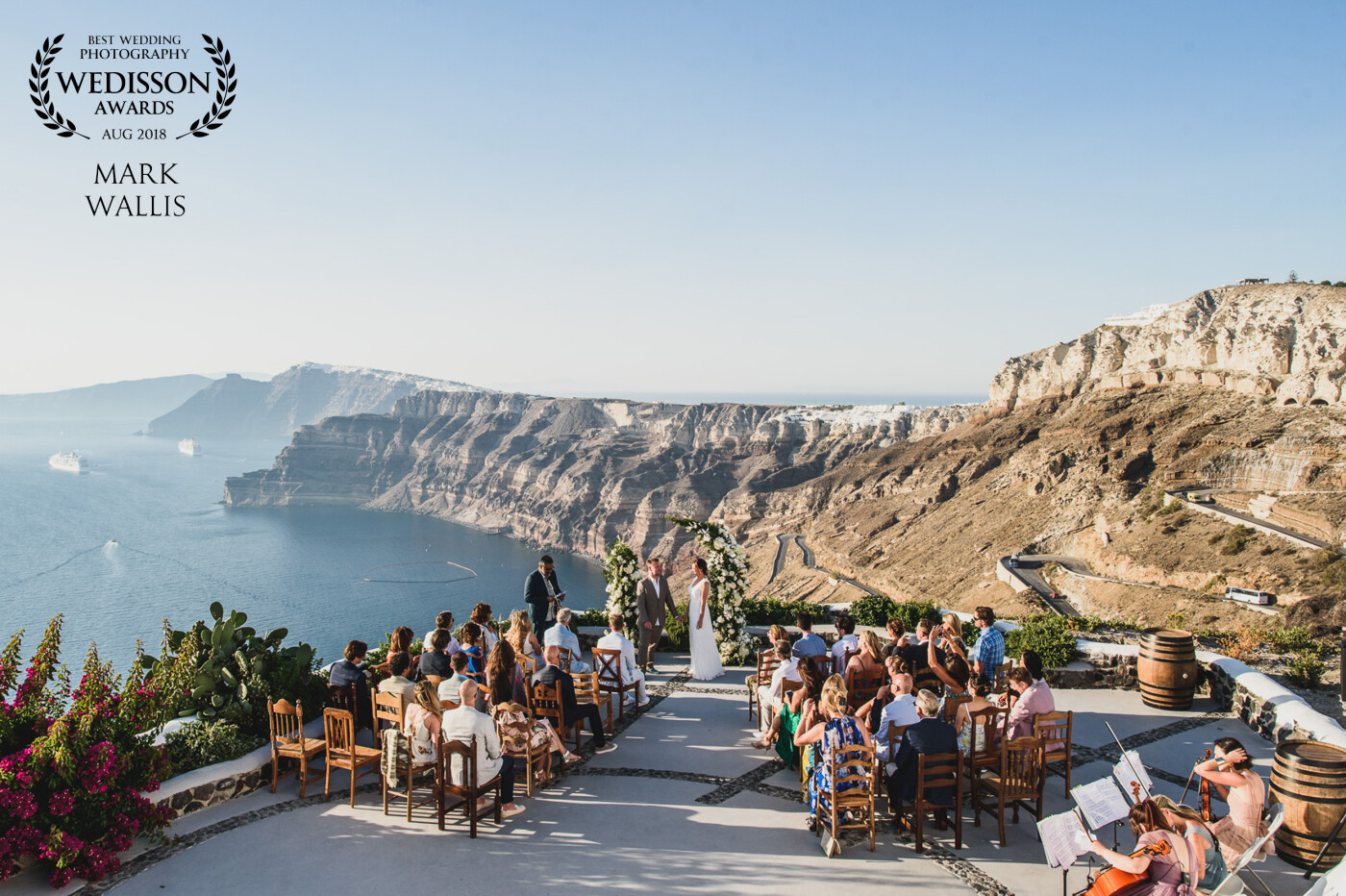 There are many reasons to get married on a clifftop on the Greek island of Santorini, but the key one is the amazing view of the caldera that dominates the place. This couple had a long 'Mamma Mia' themed ceremony which gave me the opportunity to climb a staircase and get this wide angle shot.