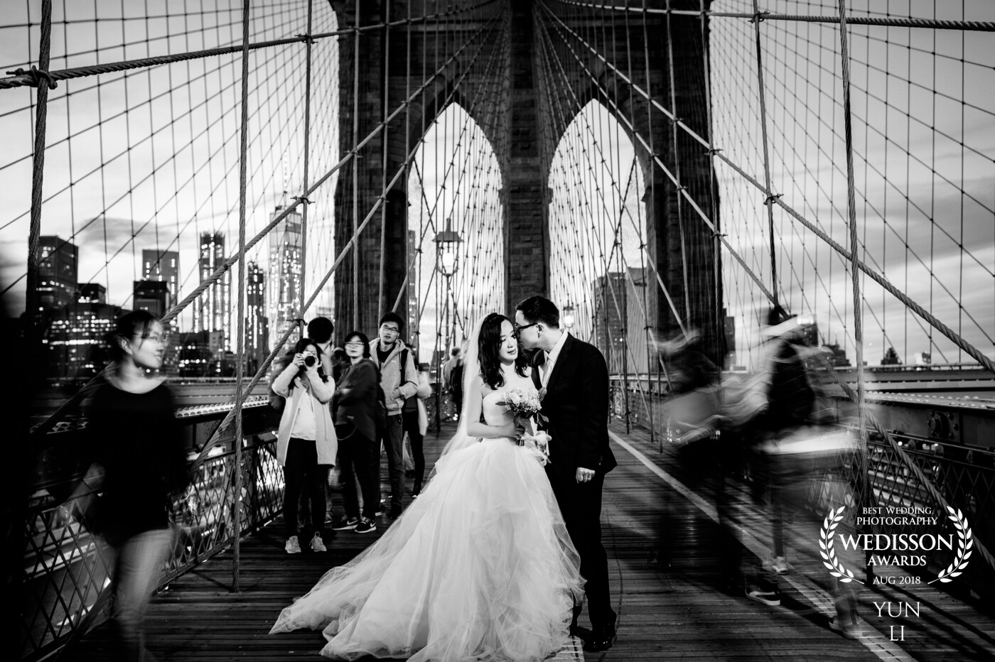 I knew that there would be a lot of people on the Brooklyn Bridge, so I brought a tripod and envisioned this image in my mind. When we got to the bridge, it was getting dark. I was able to use a shutter speed slow enough to get the intended motion blur of the crowd. Everything worked just perfectly for this image.