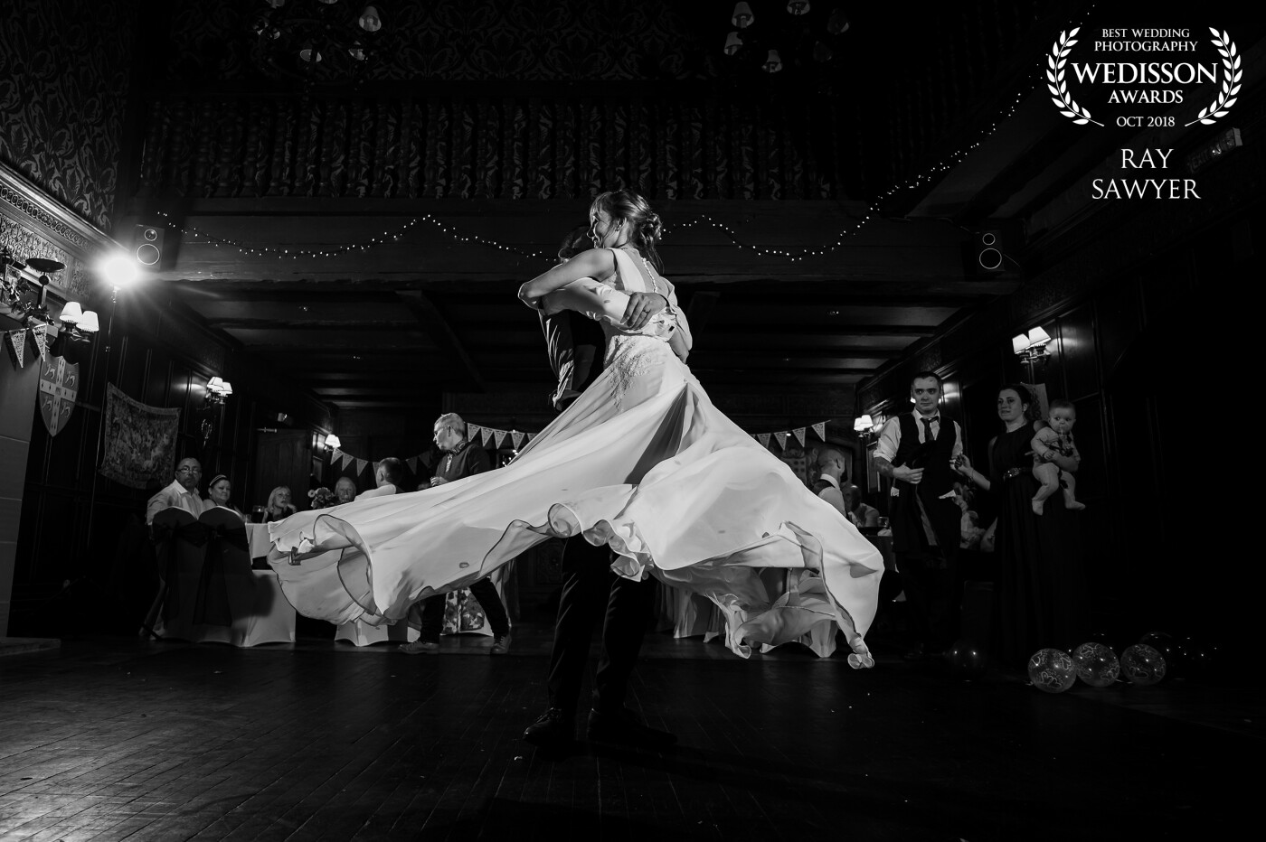 During the 1st dance the groom grabbed a hold of his wife and swung her round in the centre of the dance floor, the dress just flowed brilliantly and I froze the moment.